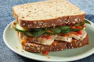Add peanut sauce and vegetables to upgrade a chicken sandwich
