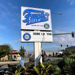 AquaSox employees place a witty saying on their marquee outside of Funko Field at Everett Memorial Stadium in Everett. (Josh Horton / The Herald)