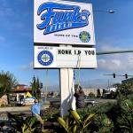 Silly signs at Funko Field greet drivers along Broadway