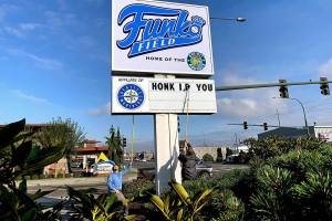 Silly signs at Funko Field greet drivers along Broadway