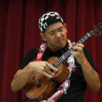 Jake Shimabukuro, a renowned ukulele player, performs Monday at Frank Wagner Elementary in Monroe. The school started a ukulele program last year and recently got grant money for new instruments. (Andy Bronson / The Herald)