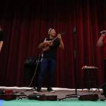Music teachers Bobbie Ann George (right) and Joanna Bivens sing Bohemian Rhapsody with Jake Shimabukuro. (Andy Bronson / The Herald)