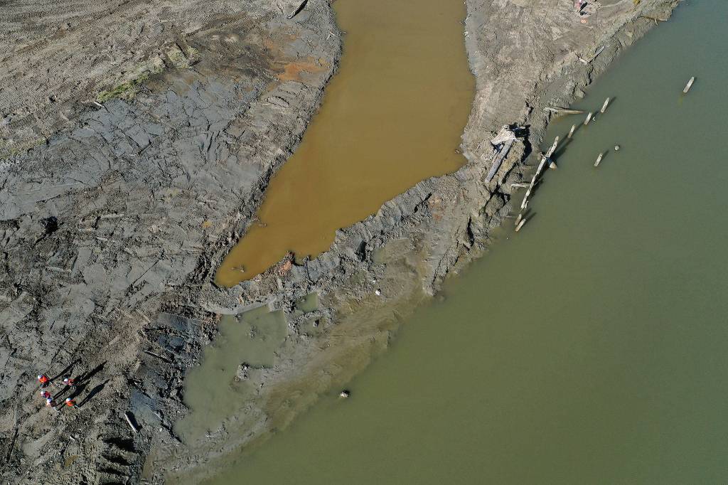 Before the Port Susan tide rose on Monday, a break was cut on the shore of the Stillaguamish River (lower right) on Leque Island near Stanwood. (Chuck Taylor / The Herald)