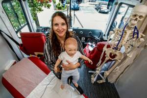 Simulation education specialist Carrie Brood, of WSUs medical school, holds a high-fidelity mannequin used for simulated patient care in the Range Health mobile unit displayed in Everett on Thursday. (Dan Bates / The Herald)