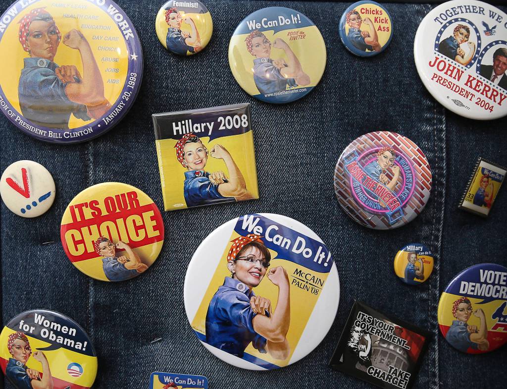 Sharon Hansons Rosie the Riveter memorabilia include campaign buttons. (Andy Bronson / The Herald)
