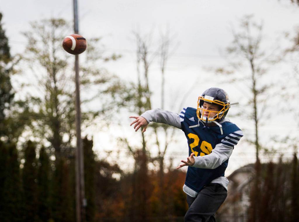 Jackson Cole throws a pass during the Mariner High School football teams Oct. 17 practice at Goddard Stadium in Everett. (Olivia Vanni / The Herald)