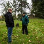 Jim Corcoran (right) talks to Ken Klein from the Snohomish County Executives Office about a small baseball field on his land near Mill Creek. (Olivia Vanni / The Herald)