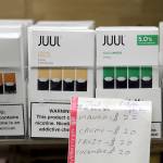 In this 2018 photo, Juul products are displayed at a smoke shop in New York. (AP Photo/Seth Wenig file)