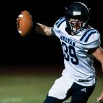 Sultans Willy Bennett runs to escape a tackle during a game against Granite Falls on Friday in Granite Falls. (Olivia Vanni / The Herald)