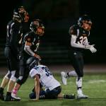 Granite Falls Dylon Cameron claps after tackling Sultans Willy Bennett during a game on Friday in Granite Falls. (Olivia Vanni / The Herald)