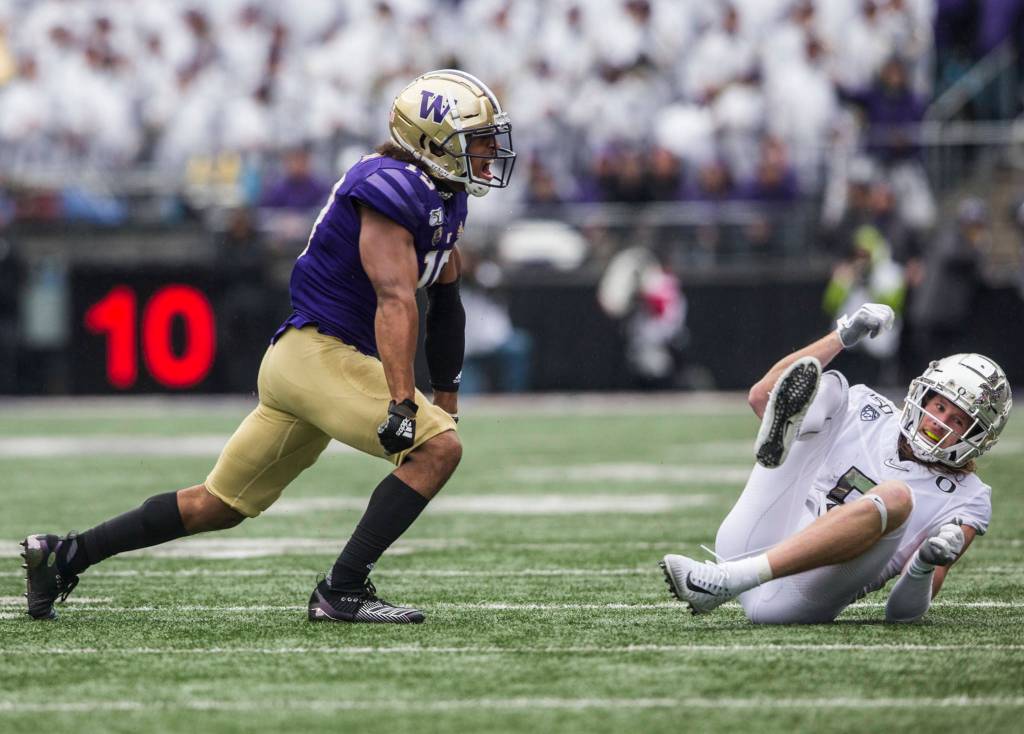 Washington Huskies linebacker Daniel Heimuli yells after blocking a pass during the game against Oregon on Saturday, Oct. 19, 2019 in Seattle, Wash. (Olivia Vanni / The Herald)