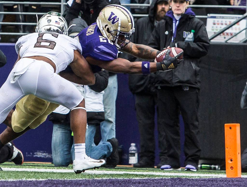Washington Huskies Salvon Ahmed dives for a touchdown during the game against Oregon on Saturday, Oct. 19, 2019 in Seattle, Wash. (Olivia Vanni / The Herald)