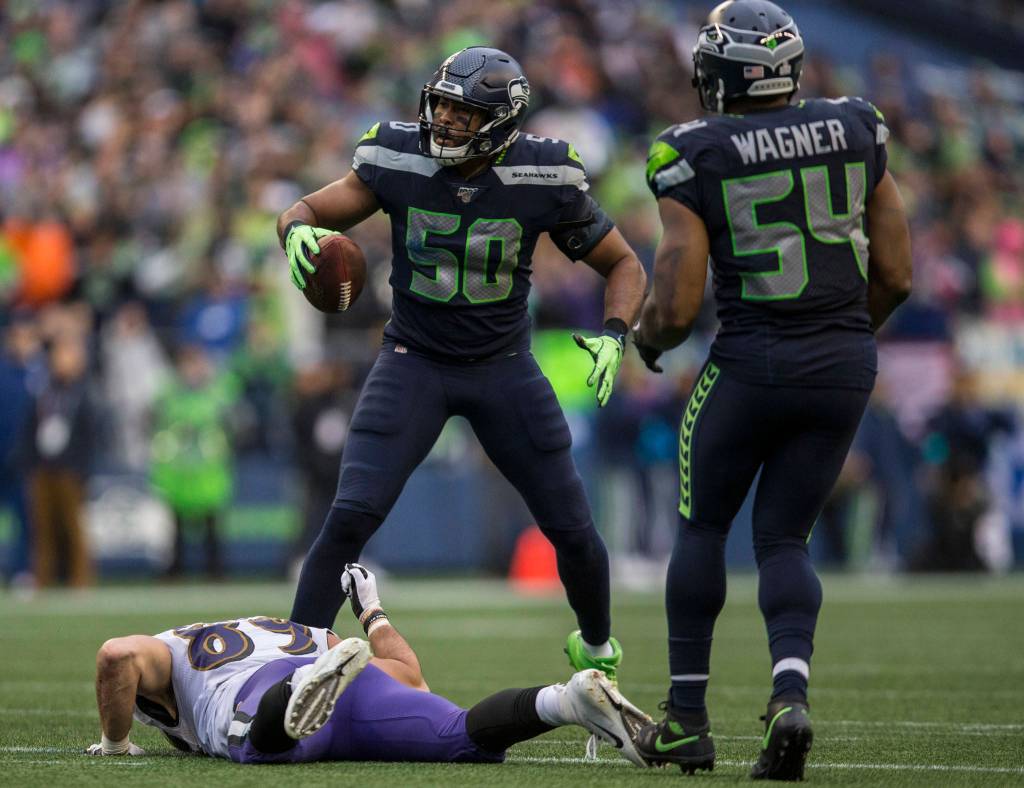 Baltimore RavensՠJustin Tucker pounds his fist on the ground after Seattle Seahawks K.J. Wright tackles him just short of a first down during the game against the Baltimore Ravens on Sunday, Oct. 20, 2019 in Seattle, Wash. (Olivia Vanni / The Herald)