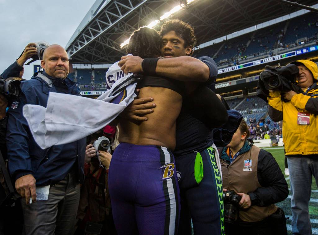 Seattle Seahawks Russell Wilson hugs former Seahawks Earl Thomas III after the game against the Baltimore Ravens on Sunday, Oct. 20, 2019 in Seattle, Wash. (Olivia Vanni / The Herald)