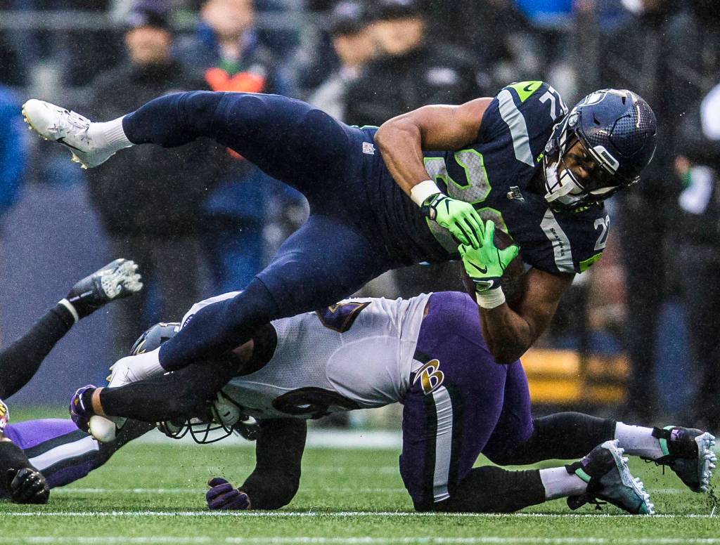 Seattle Seahawks C.J. Prosise is tackled during the game against the Baltimore Ravens on Sunday, Oct. 20, 2019 in Seattle, Wash. (Olivia Vanni / The Herald)