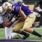 Washington Huskies Jordan Chin runs through a tackle for a touchdown during the game against Oregon on Saturday, Oct. 19, 2019 in Seattle, Wash. (Olivia Vanni / The Herald)