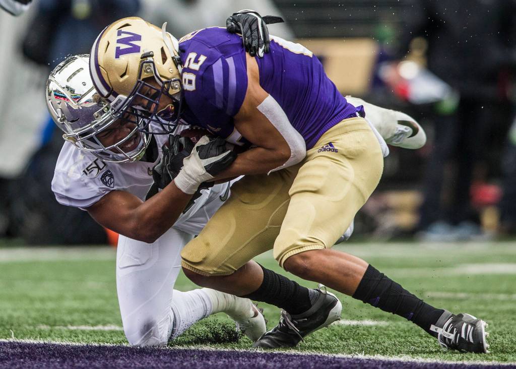 Washington Huskies Jordan Chin runs through a tackle for a touchdown during the game against Oregon on Saturday, Oct. 19, 2019 in Seattle, Wash. (Olivia Vanni / The Herald)
