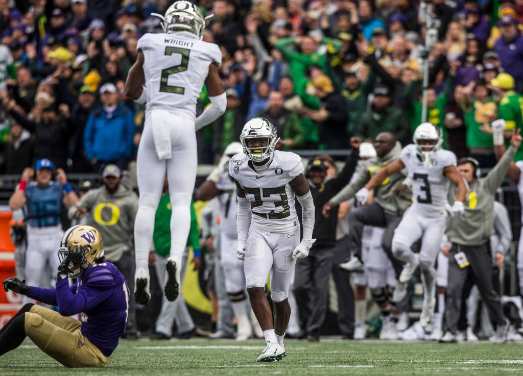 Oregon Ducks Verone McKinley III yells at teammate Oregon Ducks Mykael Wright after Jacob Easons pass is picked off sealing the win for Oregon on Saturday, Oct. 19, 2019 in Seattle, Wash. (Olivia Vanni / The Herald)