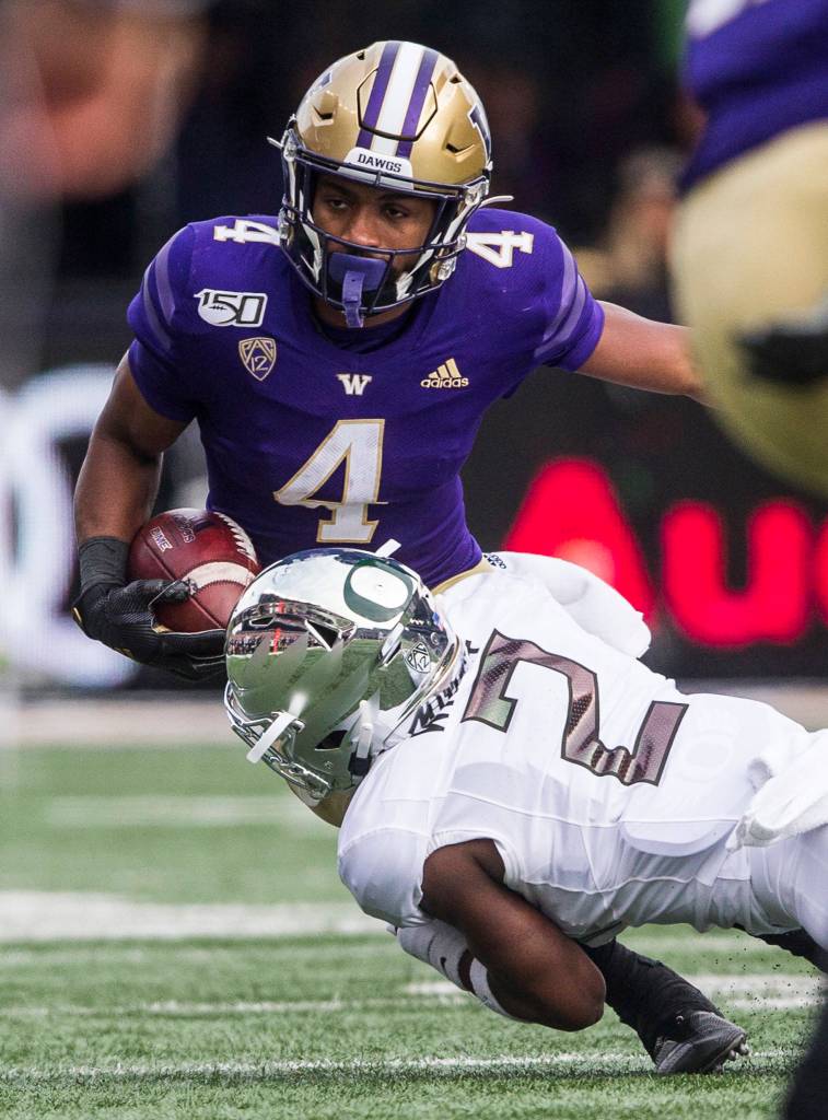 Washington Huskies Terrell Bynum is tackled by Oregon Ducks Mykael Wright during the game against Oregon on Saturday, Oct. 19, 2019 in Seattle, Wash. (Olivia Vanni / The Herald)