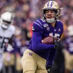 Washingtons Puka Nacua smiles as he runs the football in for a touchdown during the game against Oregon on Saturday, Oct. 19, 2019 in Seattle, Wash. (Olivia Vanni / The Herald)