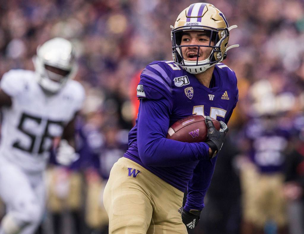 Washingtons Puka Nacua smiles as he runs the football in for a touchdown during the game against Oregon on Saturday, Oct. 19, 2019 in Seattle, Wash. (Olivia Vanni / The Herald)