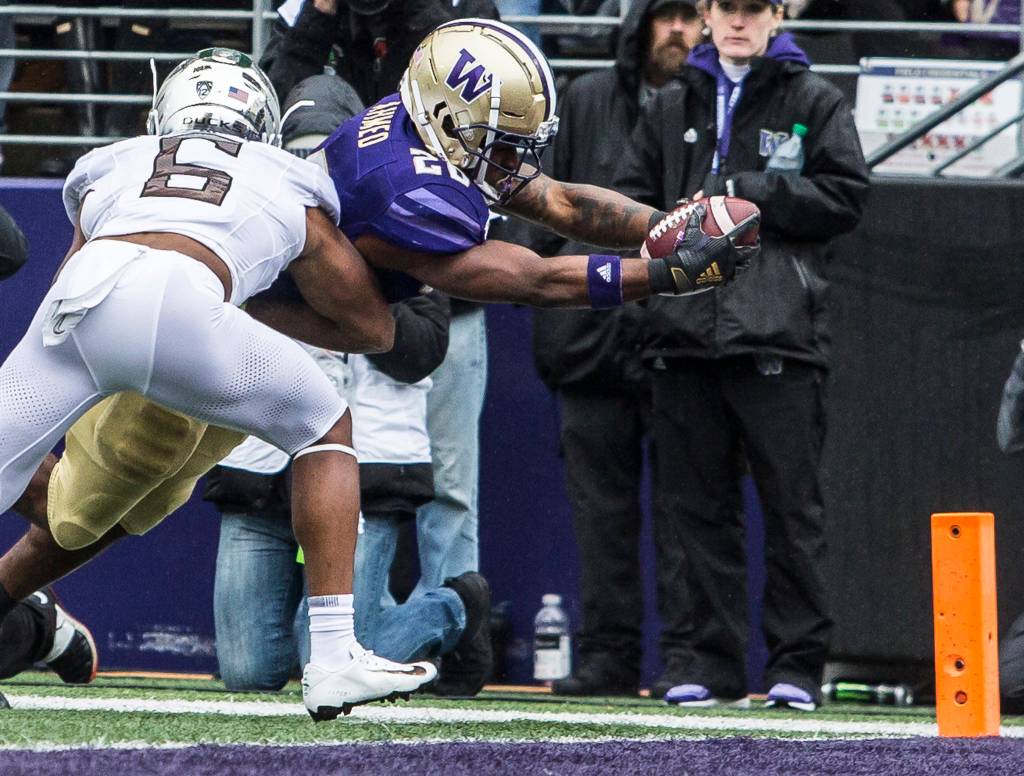 Washington Huskies Salvon Ahmed dives for a touchdown during the game against Oregon on Saturday, Oct. 19, 2019 in Seattle, Wash. (Olivia Vanni / The Herald)