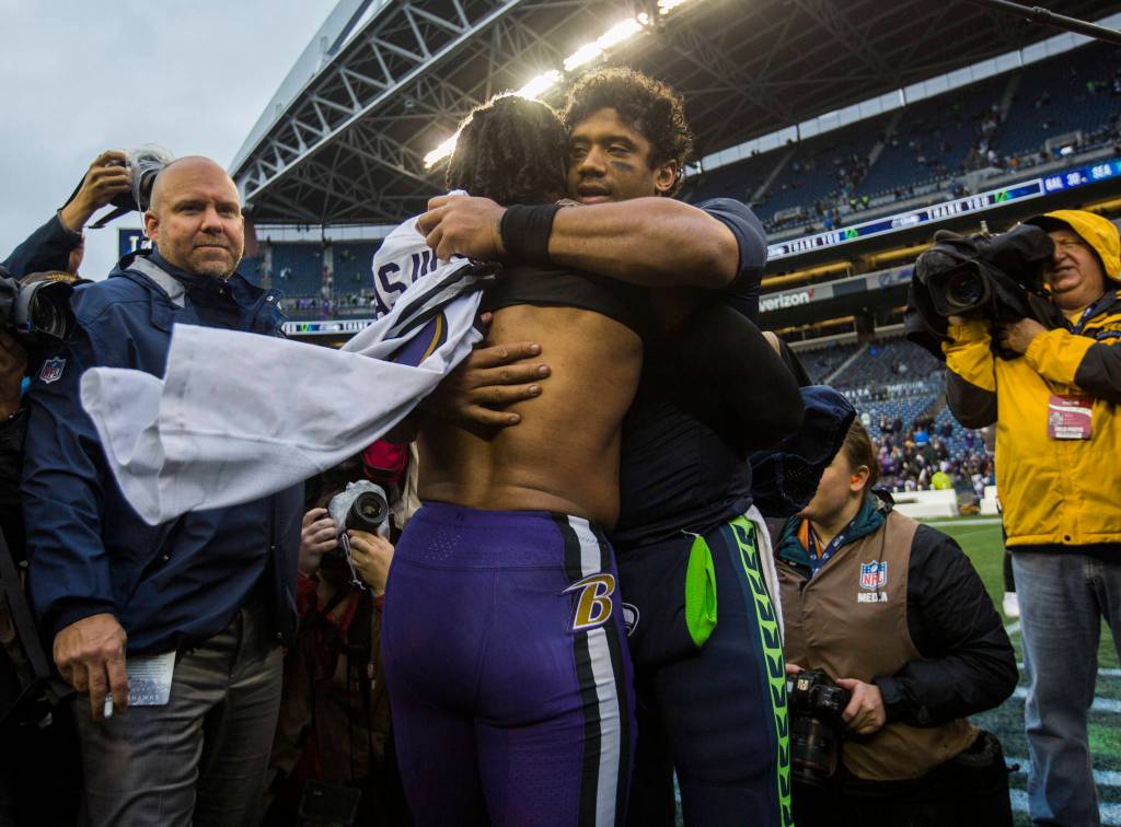 Seattle Seahawks Russell Wilson hugs former Seahawks Earl Thomas III after the game against the Baltimore Ravens on Sunday, Oct. 20, 2019 in Seattle, Wash. (Olivia Vanni / The Herald)