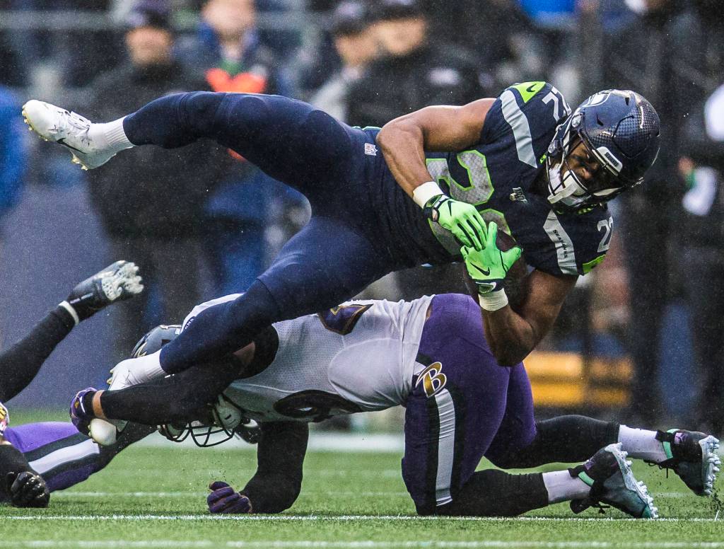 Seattle Seahawks C.J. Prosise is tackled during the game against the Baltimore Ravens on Sunday, Oct. 20, 2019 in Seattle, Wash. (Olivia Vanni / The Herald)