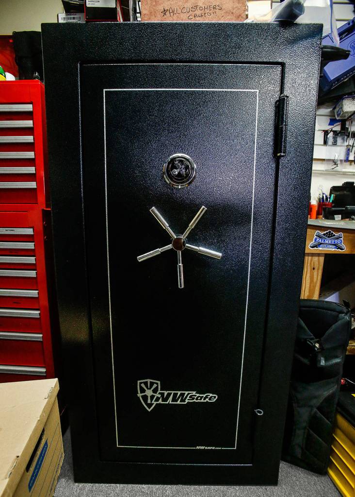 A heavy-duty safe bolted to the floor such as this one at Lynnwood Gun provides theft and fire protection for guns and other valuables, says Lynnwood Gun co-owner Tiffany Teasdale. (Dan Bates / The Herald)