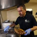 Jose Gamiz, a co-owner at the Mi Vegana Madre restaurant, prepares fresh vegan tacos in Glendale, Arizona. (AP Photo/Ross D. Franklin)