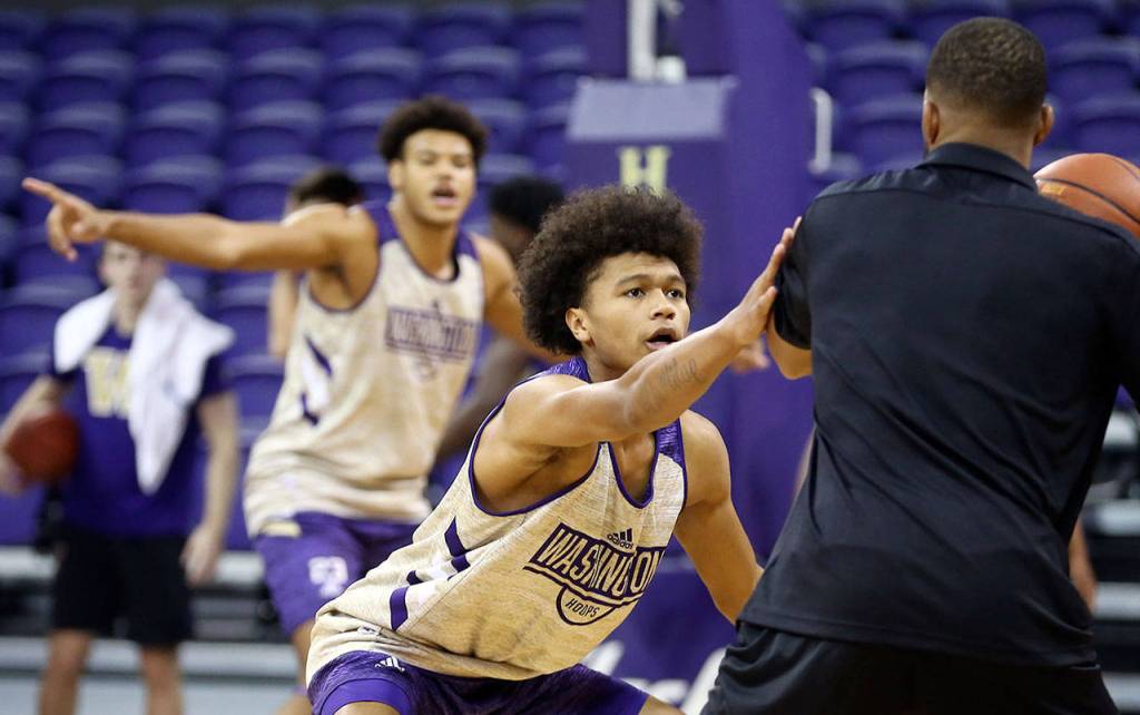 Husky freshman and Marysville Pilchuck alumni RaeQuan Battle plays defense during practice Tuesday afternoon at Alaska Airlines Arena in Seattle. (Kevin Clark / The Herald)