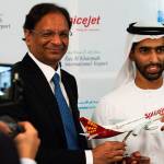 SpiceJet chairman and managing director Ajay Singh (left) and Sheikh Khalid bin Saud Al Qasimi, a son of Ras al-Khaimah ruler Sheikh Saud bin Saqr Al Qasimi pose for photographs during a news conference Wednesday in Ras al-Khaimah, United Arab Emirates. Indias low-cost airline SpiceJet announced plans Wednesday to build its first international hub in the United Arab Emirates, offering a pledge of support to Boeing Co. by saying it would use now-grounded 737 MAX aircraft in the operation once regulators approve the planes for flight. (AP Photo/Jon Gambrell)