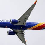 In this March 13 photo, a Southwest Airlines Boeing 737 Max 8 jet flies over Mesa, Arizona, en route to Phoenixs Sky Harbor International Airport. (AP Photo/Elaine Thompson, File)