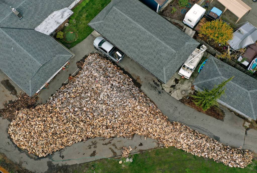 From the air, the most prominent feature at Shane McDaniels house in Lake Stevens is a growing woodpile. (Chuck Taylor / The Herald)
