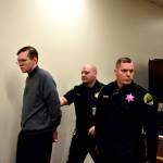 Anthony Garver is led out of the courtroom at break in his testimony Friday in Snohomish County Superior Court. (Caleb Hutton / The Herald)