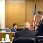 Deputy prosecutor Matt Hunter cross-examines Anthony Garver (left) during his murder trial Friday in Snohomish County Superior Court. (Caleb Hutton / The Herald)