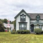 One of Oystervilles oldest homes was built in 1869. The federal land grant deed, signed by President Abraham Lincoln, still hangs on a wall inside. The house is now owned by Sydney Stevens, a descendant of Oysterville co-founder R.H. Espy. In the background is the Oysterville Church, built in 1892 and usually open for tours. (Photo by Patricia Jollimore)