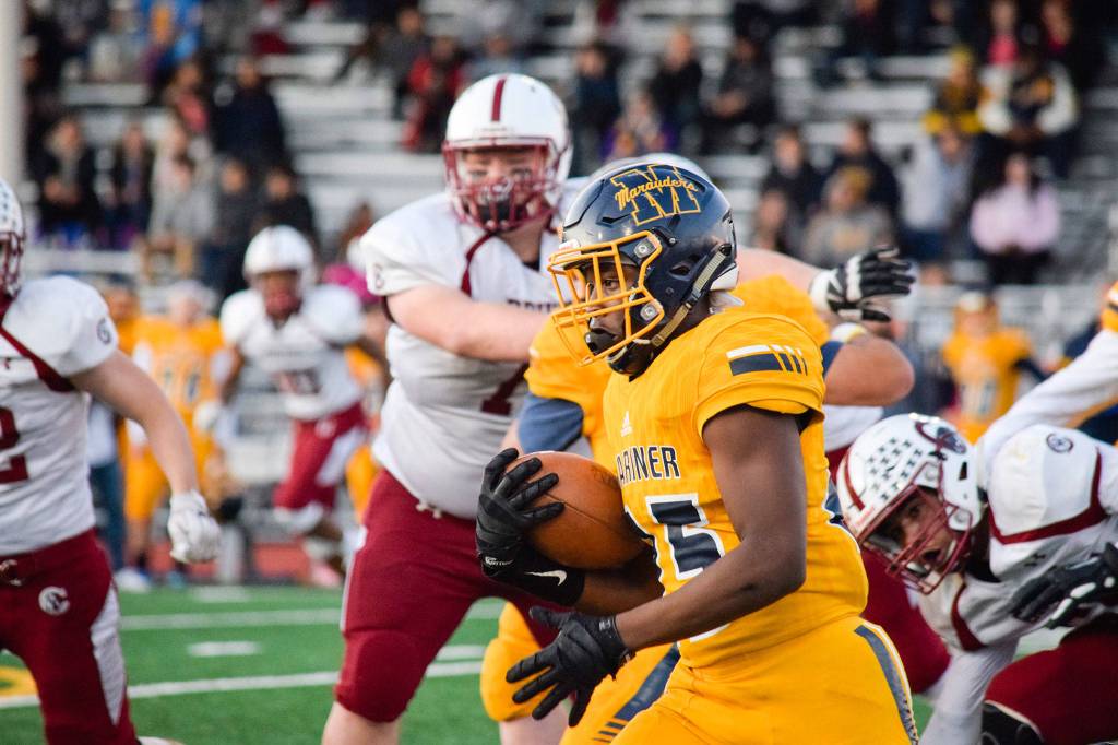 Freshman running back Cartez Williams runs for a first down against Cascade on Friday, Oct. 25 at Goddard Stadium in Everett. (Katie Webber / The Herald)