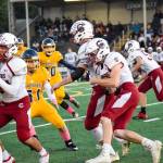 Senior running back Kolby Wilson-Kirkpatrick returns the ball for Cascade against Mariner on Friday, Oct. 25 at Goddard Stadium in Everett. (Katie Webber / The Herald)