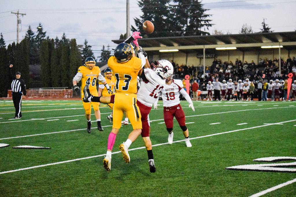 Cascades defensive back Edgar Rendiz breaks up a pass to Mariners wide receiver Fernando Contreras (left) on Friday, Oct. 25 at Goddard Stadium in Everett. (Katie Webber / The Herald)