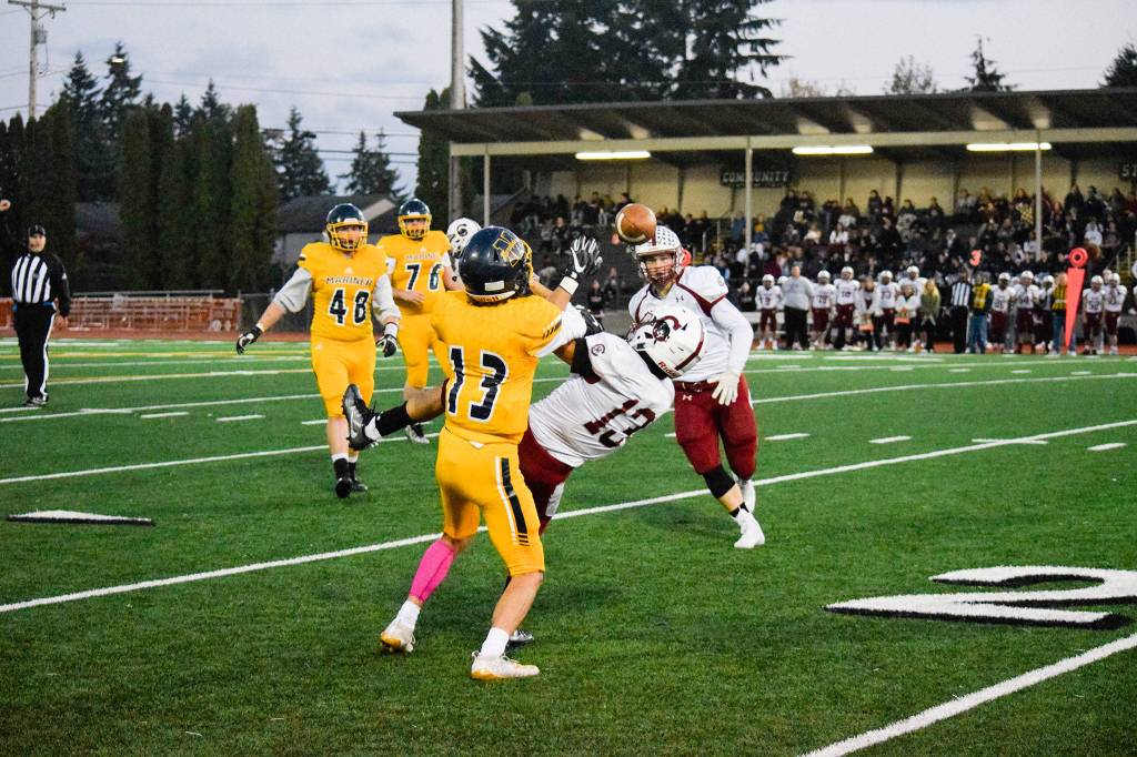 Cascades defensive back Edgar Rendiz breaks up a pass to Mariners wide receiver Fernando Contreras (left) on Friday, Oct. 25 at Goddard Stadium in Everett. (Katie Webber / The Herald)