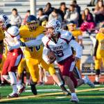 Sophomore running back Xander Larsen runs through the Mariner defense on Friday, Oct. 25 at Goddard Stadium in Everett. (Katie Webber / The Herald)