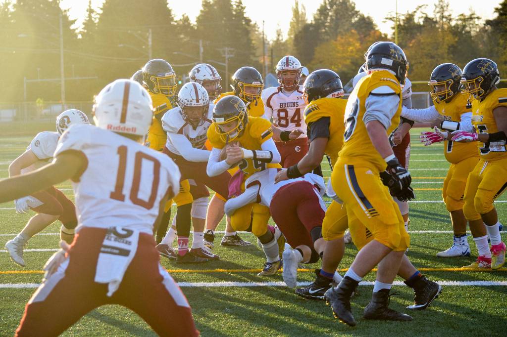 Junior quarterback Jackson Cole runs in for a touchdown against Cascade on Friday, Oct. 25 at Goddard Stadium in Everett. (Katie Webber / The Herald)