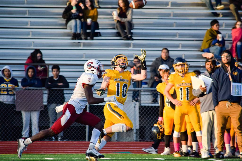 Senior wide receiver Roman Savchuk runs down the sideline before catching a first down against Cascade on Friday, Oct. 25 at Goddard Stadium in Everett. (Katie Webber / The Herald)