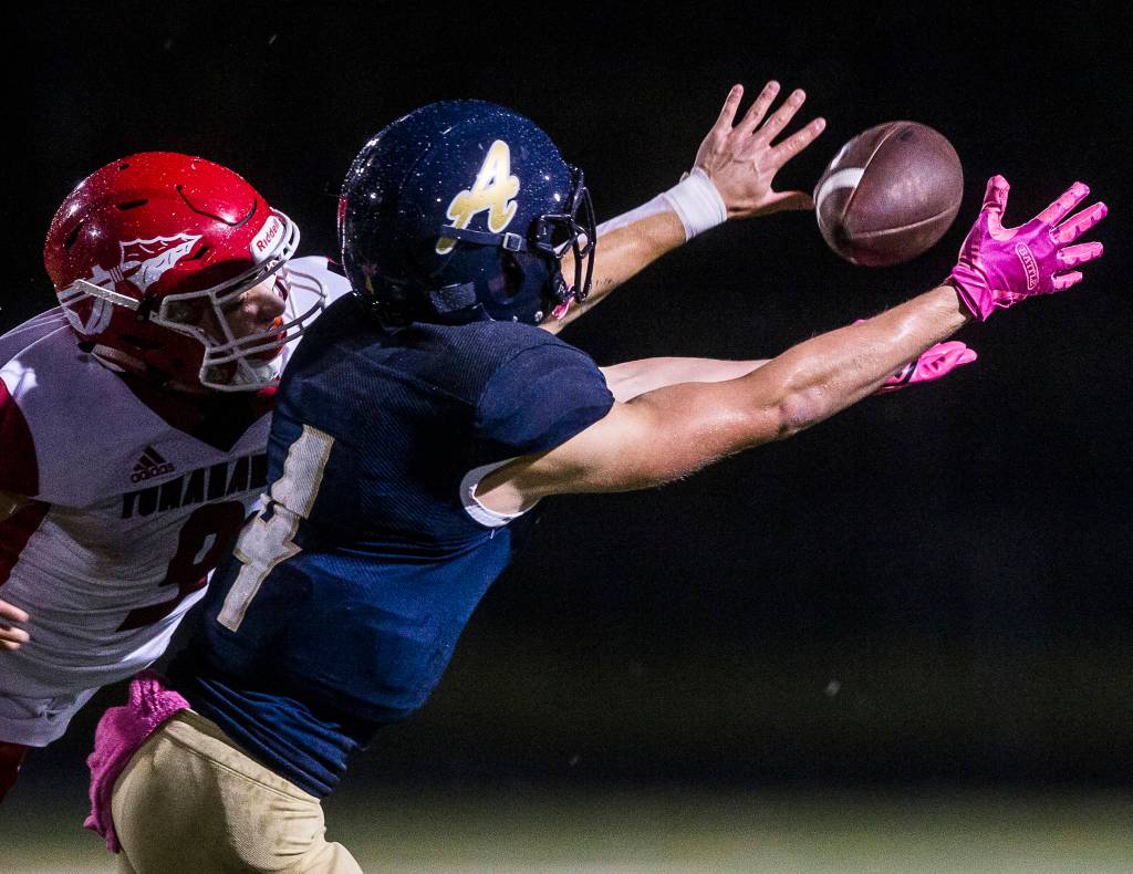 Marysville-Pilchuckճ Jordan Justice blocks a pass to Arlingtonճ Joseph Schmidt during the game on Oct. 25, 2019 in Arlington, Wash. (Olivia Vanni / The Herald)