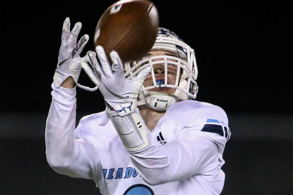 Meadowdales Samuel Lybeer makes a reception resulting a in touchdown against Snohomish Friday evening at Veterans Memorial Stadium in Snohomish on October 25, 2019. (Kevin Clark / The Herald)