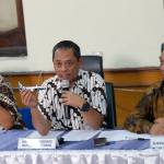 National Transportation Safety Committee investigator Nurcahyo Utomo (center) holds a model of an airplane and Chairman of the National Transportation Safety Committee Soerjanto Tjahjono (right) listens during a press conference in Jakarta, Indonesia on Friday. An Indonesian investigation found a Lion Air flight that crashed and killed 189 people a year ago was doomed by a combination of aircraft design flaws, inadequate training and maintenance problems. (AP Photo/Tatan Syuflana)