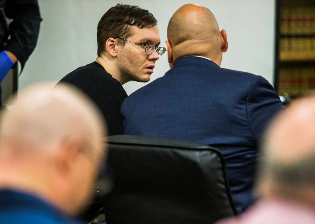 Olivia Vanni / The Herald                                 Anthony Garver talks with his attorney as the judge speaks to those courtroom at the Snohomish County Courthouse on Tuesday.
