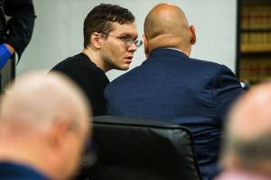 Anthony Garver talks with his attorney as the judge reads his remarks before the verdict at the Snohomish County Courthouse on Tuesday in Everett. (Olivia Vanni / The Herald)