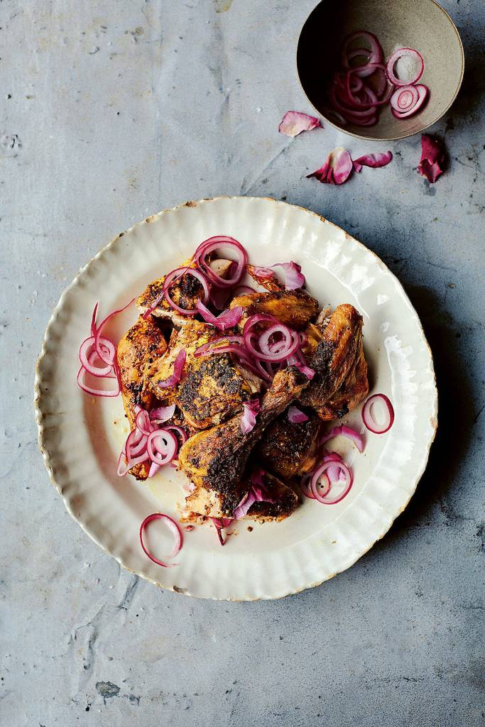 Watch a YouTube video on how to spatchcock before making Persian-spiced spatchcocked chicken with quick-pickled red onions and dill yogurt. (Photo by Laura Edwards)